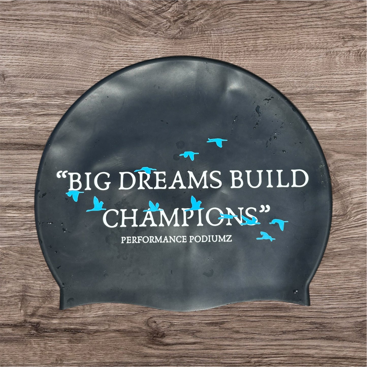 casque de bain noir et bleu "Big dreams build champions"(taille standard)